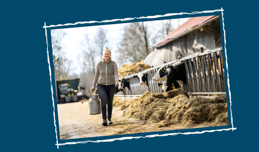 Rieke mit Milchkanne im Kuhstall