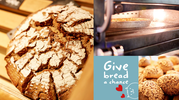KI generiert: Brotlaibe und Brötchen, ein Ofen und der Text: "Give bread a chance".